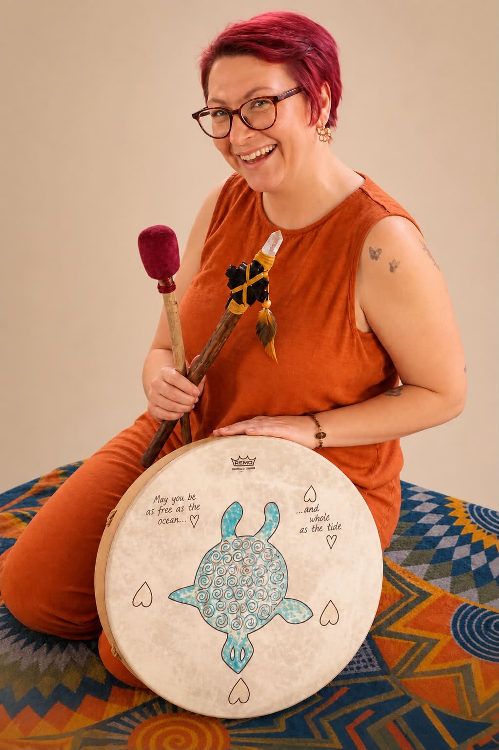 Michelle Hawes holding her ceremonial drum